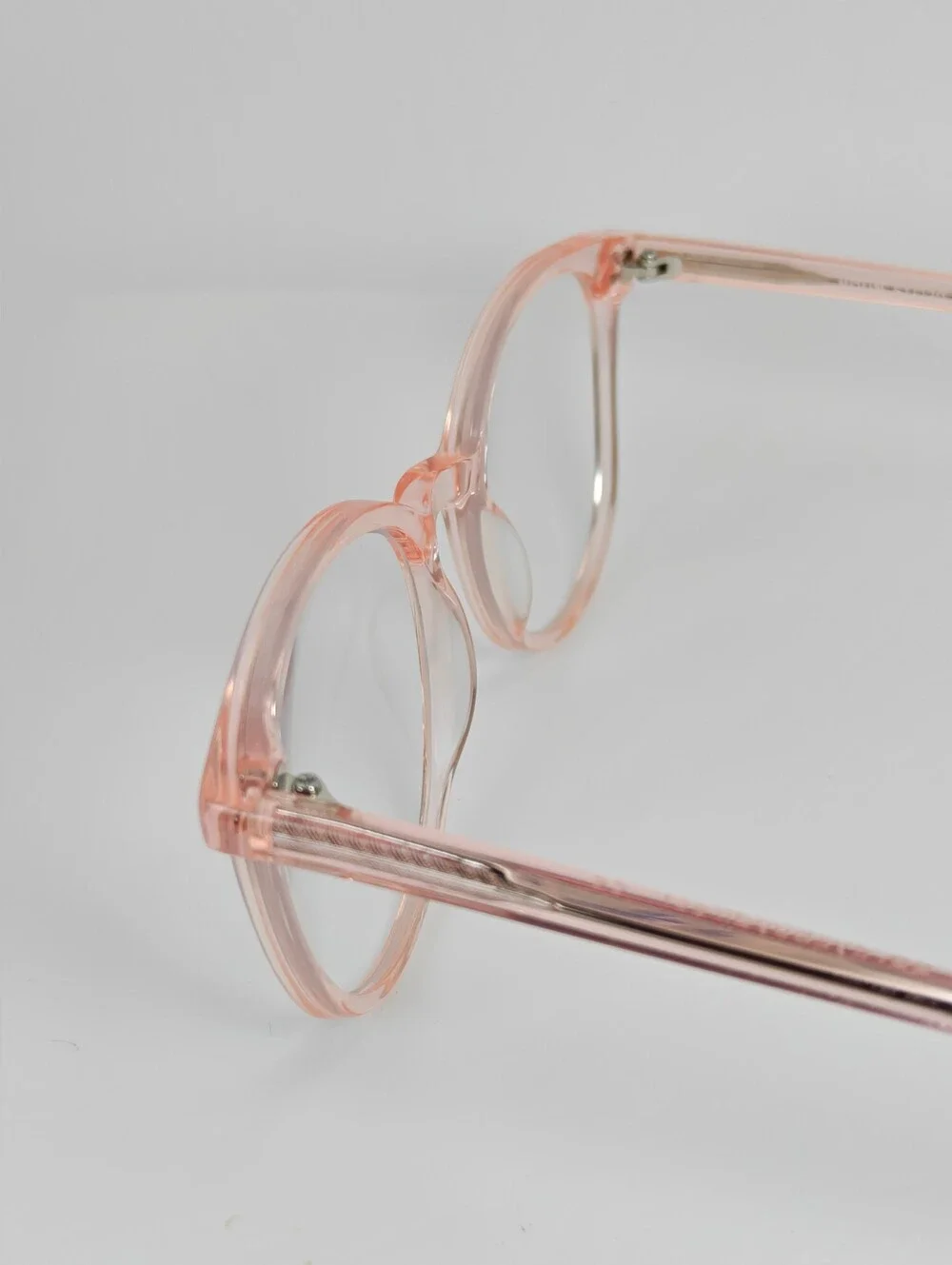 Noun. Transparent Pink Round Women's Eyeglasses. Minimalist..